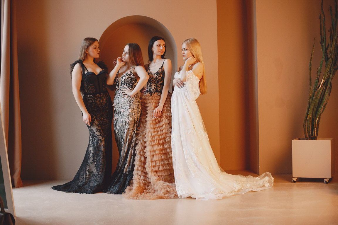 Women in Long Gowns Posing in Studio